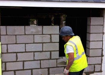 Hurricane Sandy Man Preparing Wall