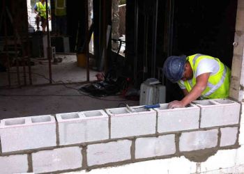 Hurricane Sandy Man Working On Wall