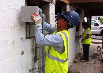 Hurricane Sandy Men Replacing Blocks